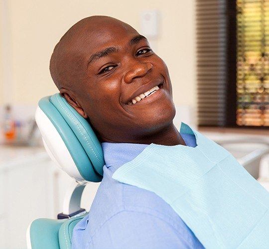 man laying in exam chair