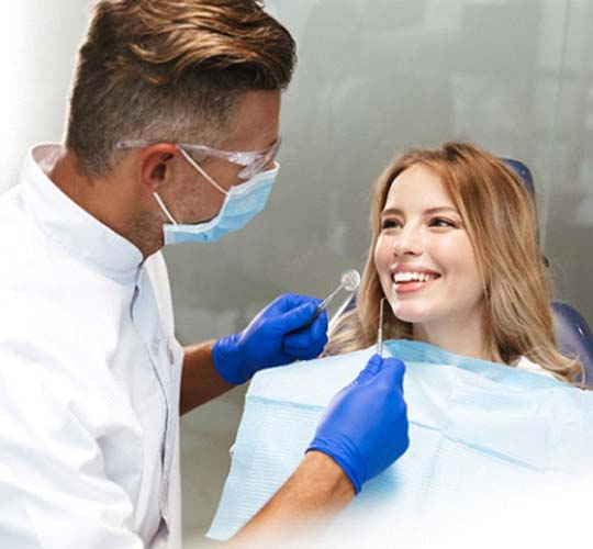Westport implant dentist performing a dental exam on patient