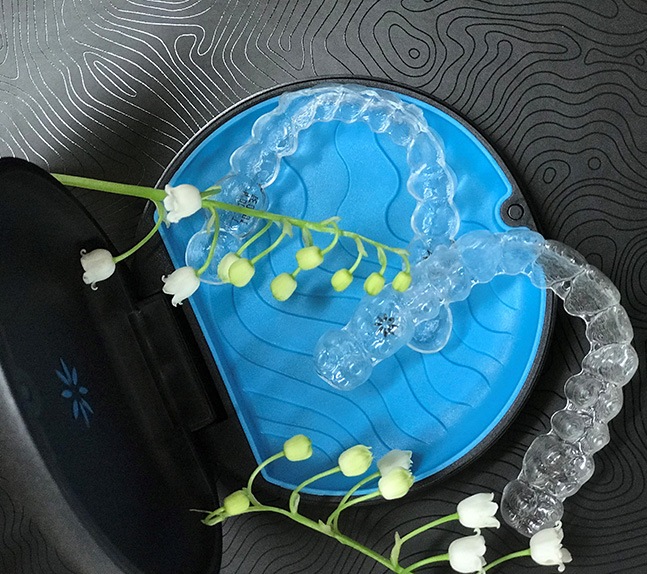 invisalign trays in blue container