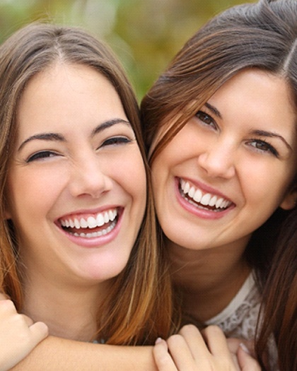 Two young girls smiling