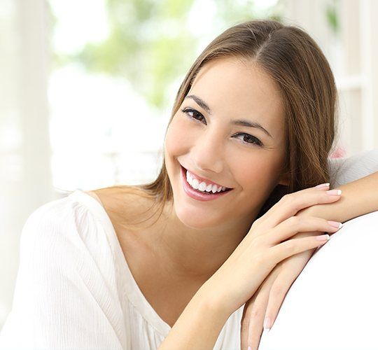 woman in white smiling