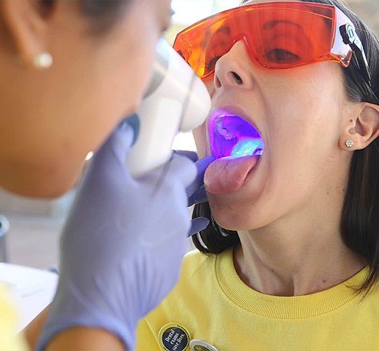 woman getting oral cancer screening