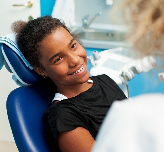 Young girl in exam chair