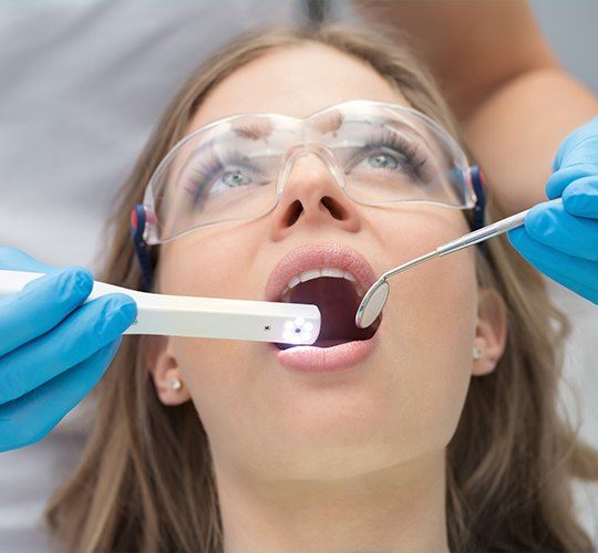 dentist using intraoral camera