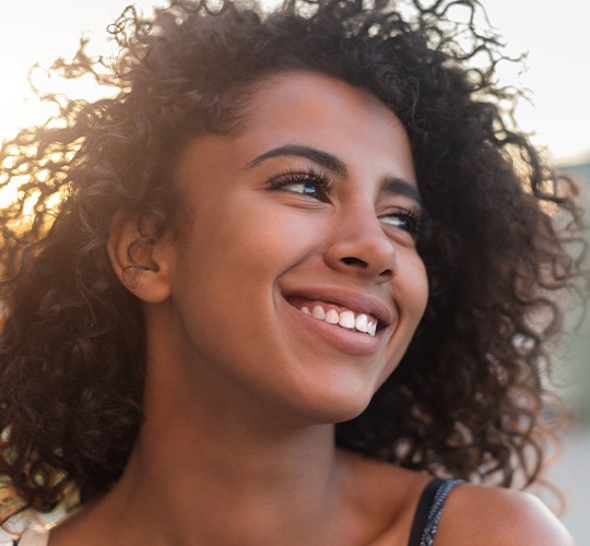 woman smiling outside