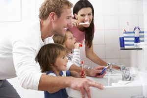 entire family brushing teeth 