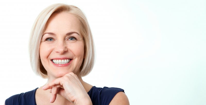 woman smiling after full mouth reconstruction